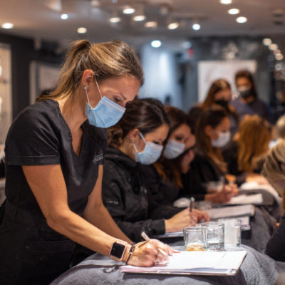 Group of people wearing masks and attending a class